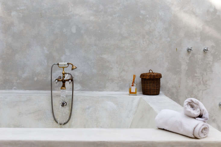 in the spa, a sculptural bath with brass faucet mixes mayan with modern. 25