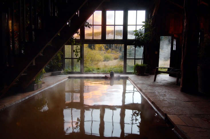 the bathhouse interior features a large pool. 18