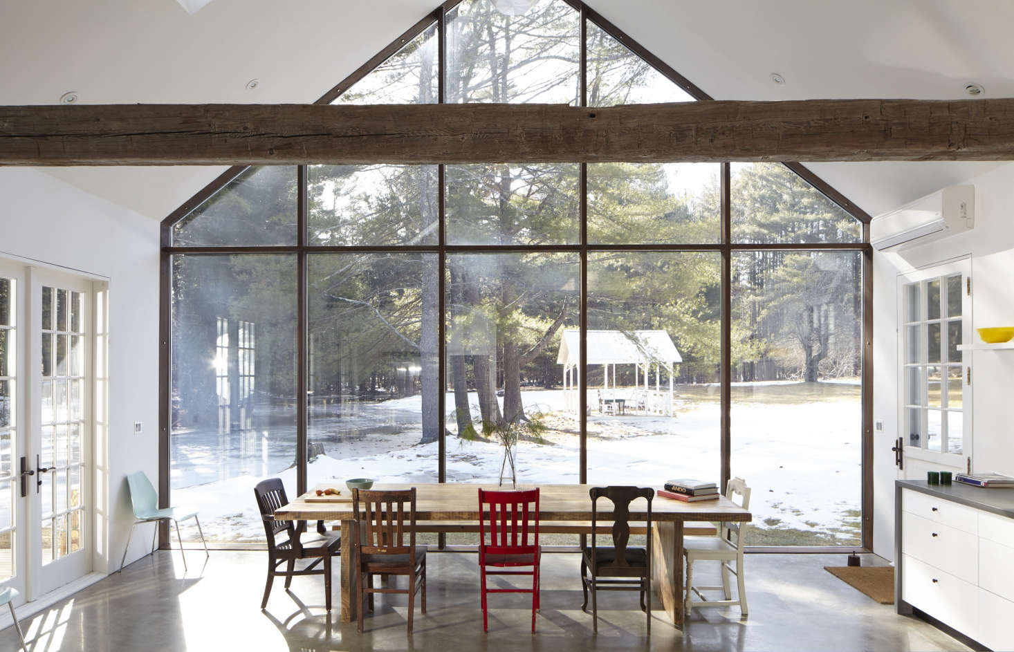 The kitchen resides in a modern addition that echoes the roofline of the original house. The