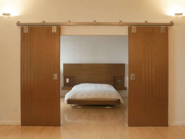 barn doors reveal a bed for the barlow lawson apartment: click here for more in 68
