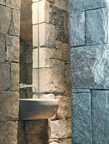 powder room: a custom concrete sink cantilevered from a stone niche 18