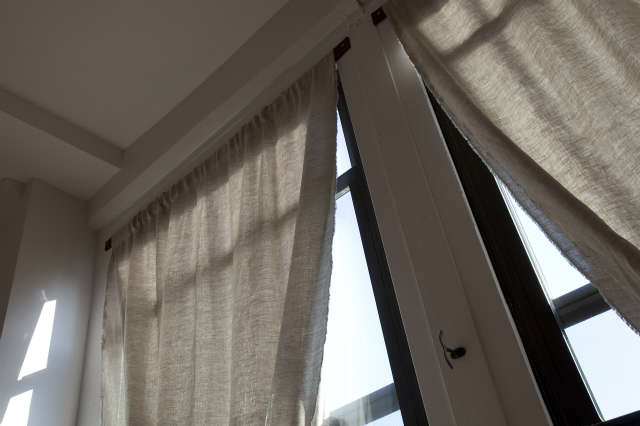 Infinity Loop Drapery: Custom window treatment for the Downtown Brooklyn Residence. Leather strap and sheer linen Infinity Loop drapery, to be fashioned as you please.