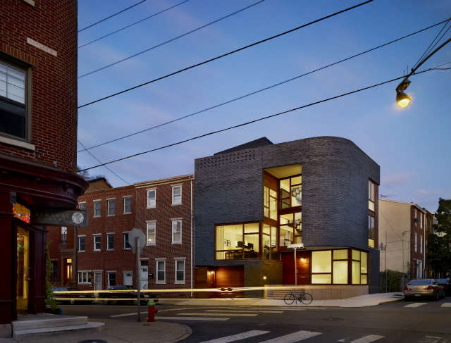 split level house: sited on a vacant corner in philadelphia, this house stitche 11