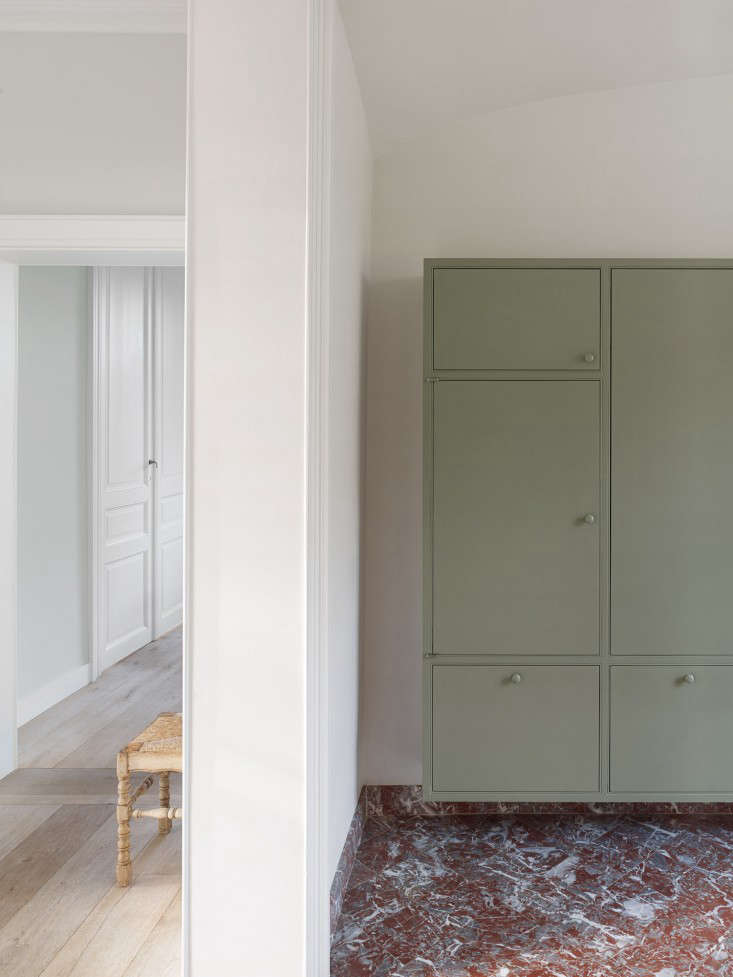 green cabinets are seen throughout a house in the flemish countryside by buyse  24