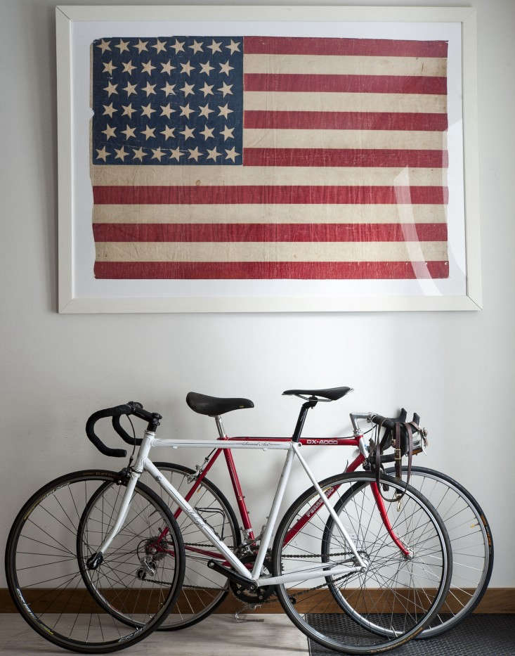 an antique framed american flag bought on ebay in an apartment architected by o 18