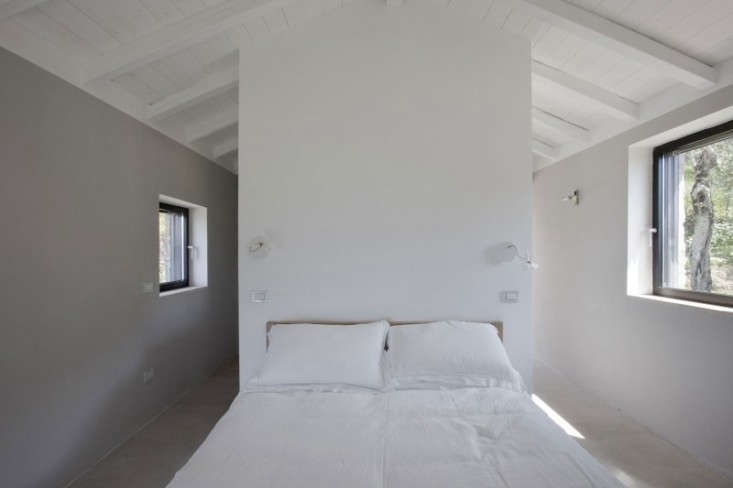 a sanctuary in the summer months: a pale bedroom with white linens. 21