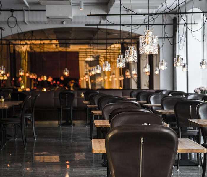 the hotel restaurant is illuminated by a metal framework of cut glass pendant l 25