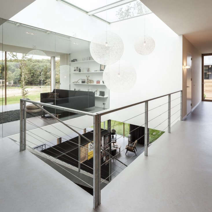 a skylight fills the stairwell with natural light. 26