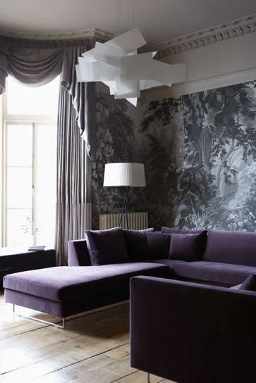 purple velvet sofa with wallpaper