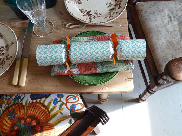 crackers are a traditional addition to holiday tables in the uk, as seen here,  23