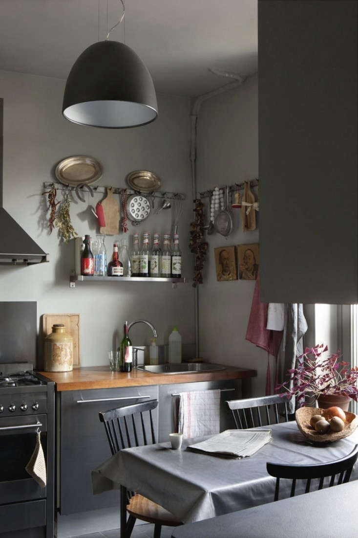 a pleasantly cluttered kitchen in a french apartment, available for rent; see c 21