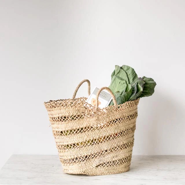 the lightweight, open weave moroccan market tote is \$\1\29 from elsie green. 24