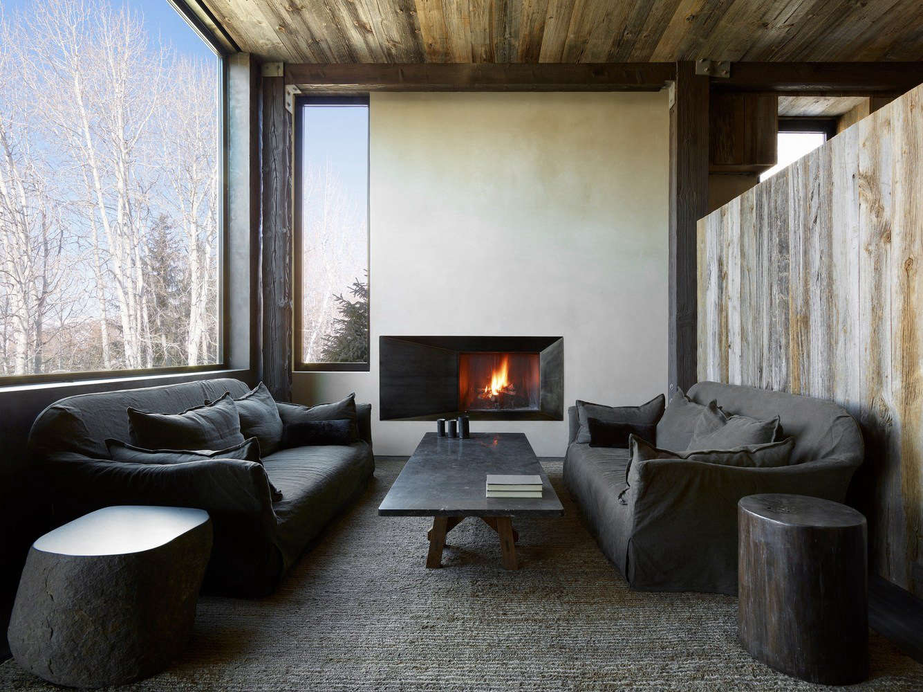 A pair of Charlotte Sofas by Verellen are slipcovered in gray linen.