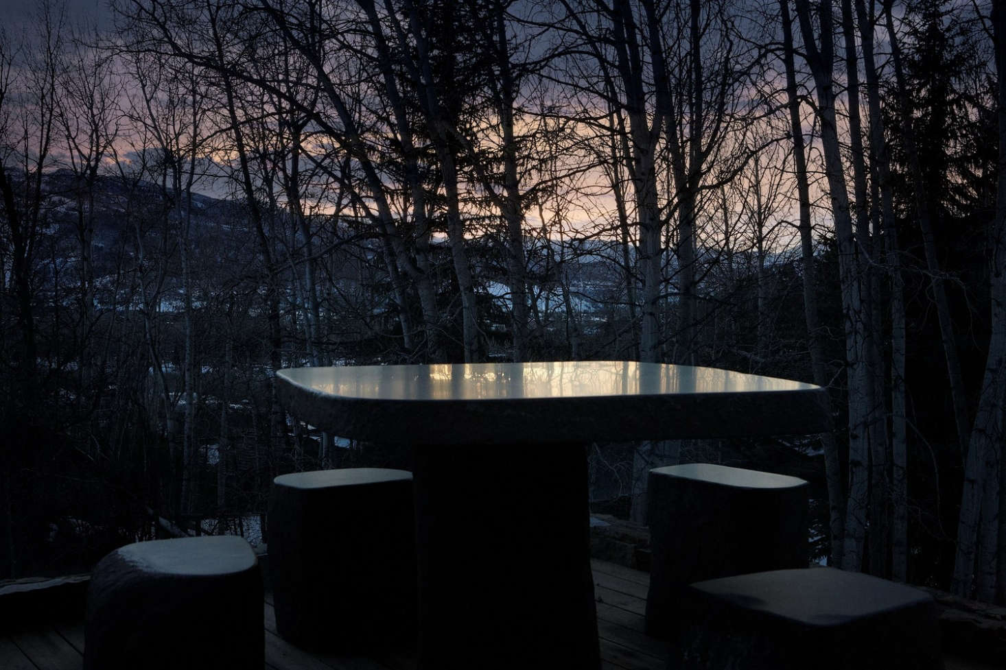 An outdoor table carved from stone.