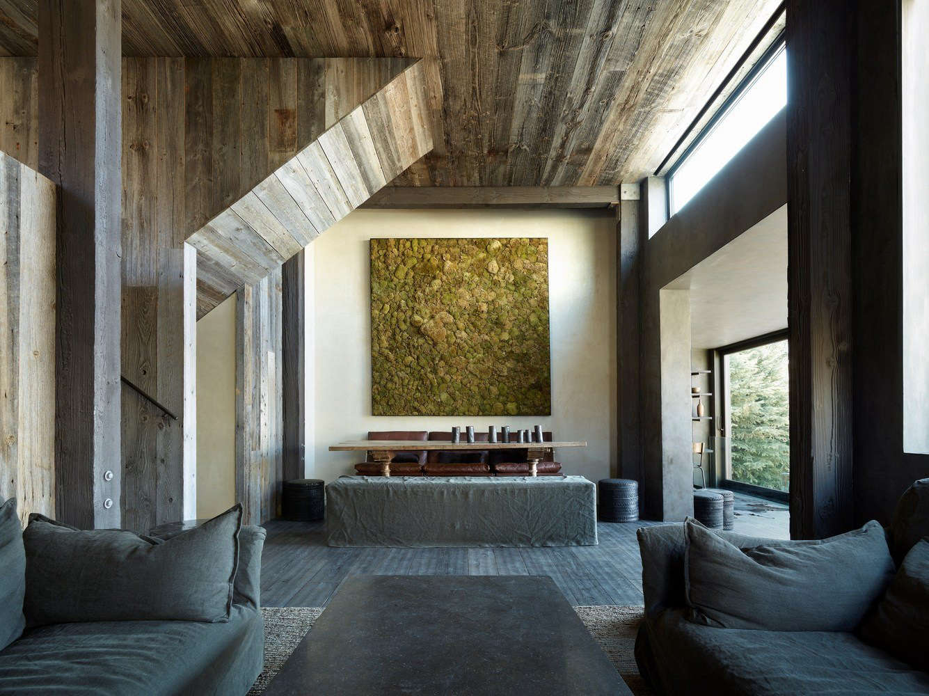 A series of grays intersect in the living room. The moss frame is from JF Chen in Los Angeles.