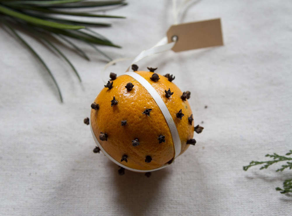 One of our favorite all-time DIY ornaments is also one of the simplest: a traditional pomander made of an orange studded with whole cloves and hung from a length of ribbon. You could even tuck a small pouch of cloves into one of the days of your advent calendar (see idea no. 5) for a festive (and good-smelling) activity.