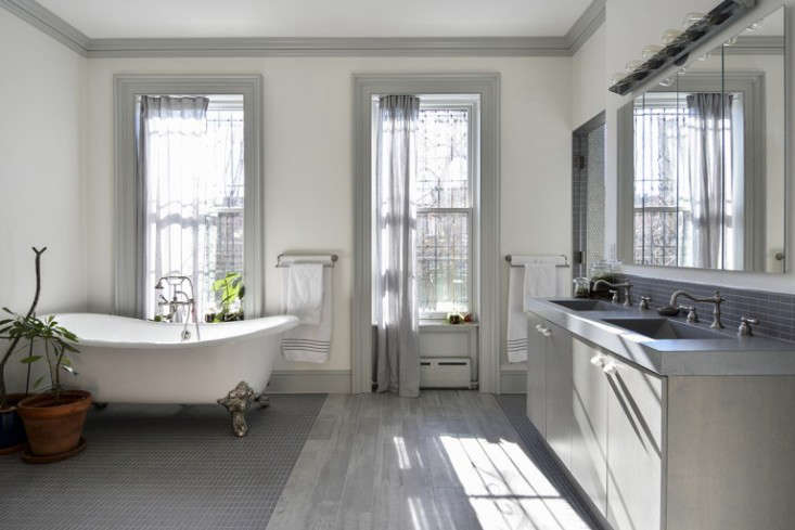 The concrete sinks and vanity are of a piece in Two Young Architects Tackle Their Own Brooklyn Townhouse. Photography by Carl Bellavia.