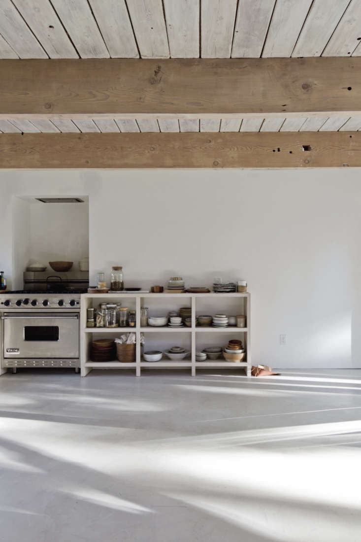 a flush, ceiling mounted range hood looks seamless in a north vancouver kitchen 17