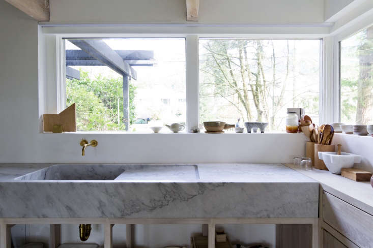 an integrated marble sink (with drain board) carved from a huge slab of ma 18