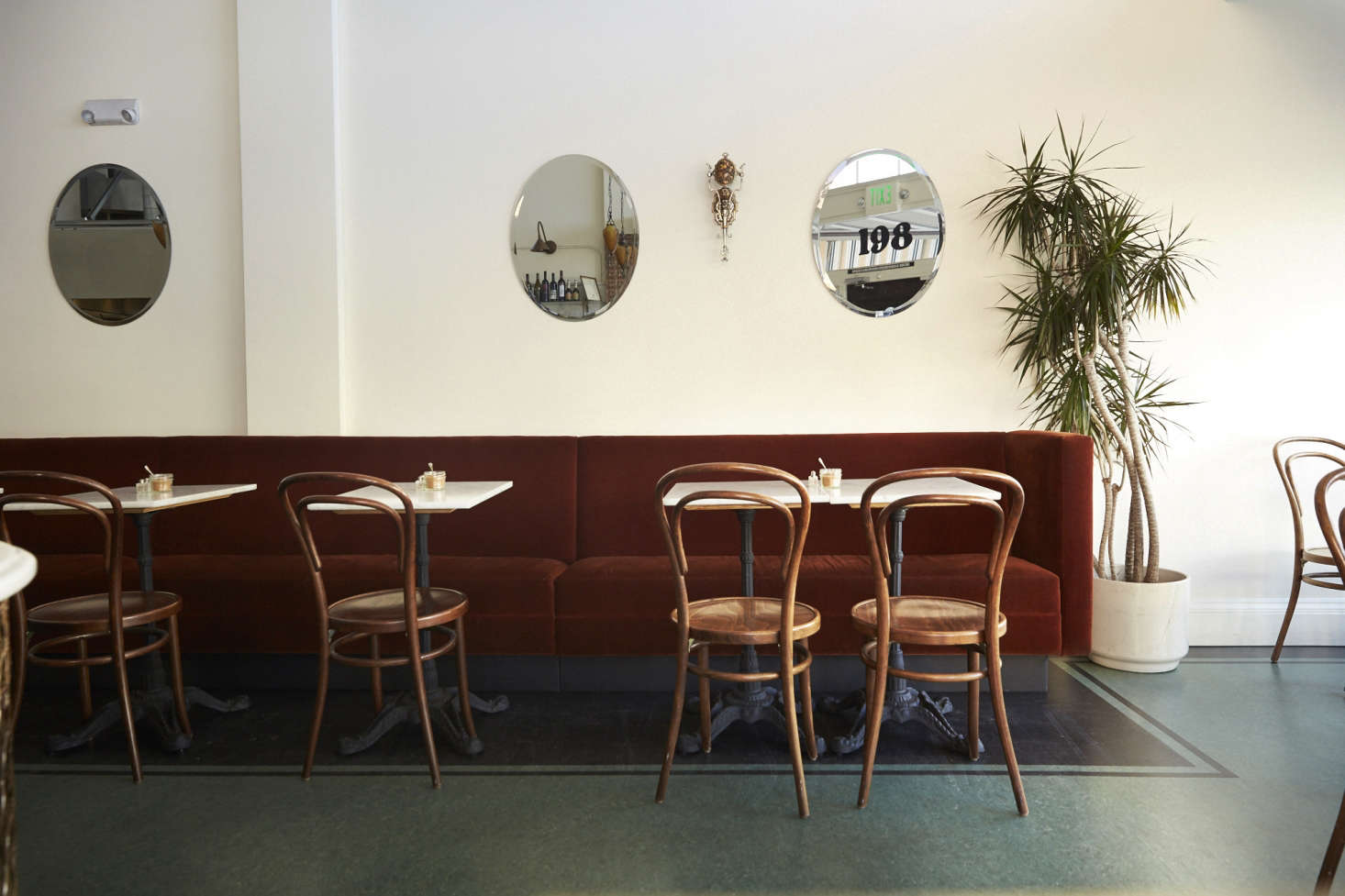 Deep green linoleum looks chic, not tacky, at Twentieth Century Cafe: Old Vienna Comes to San Francisco. Photograph by Laurie Frankel.