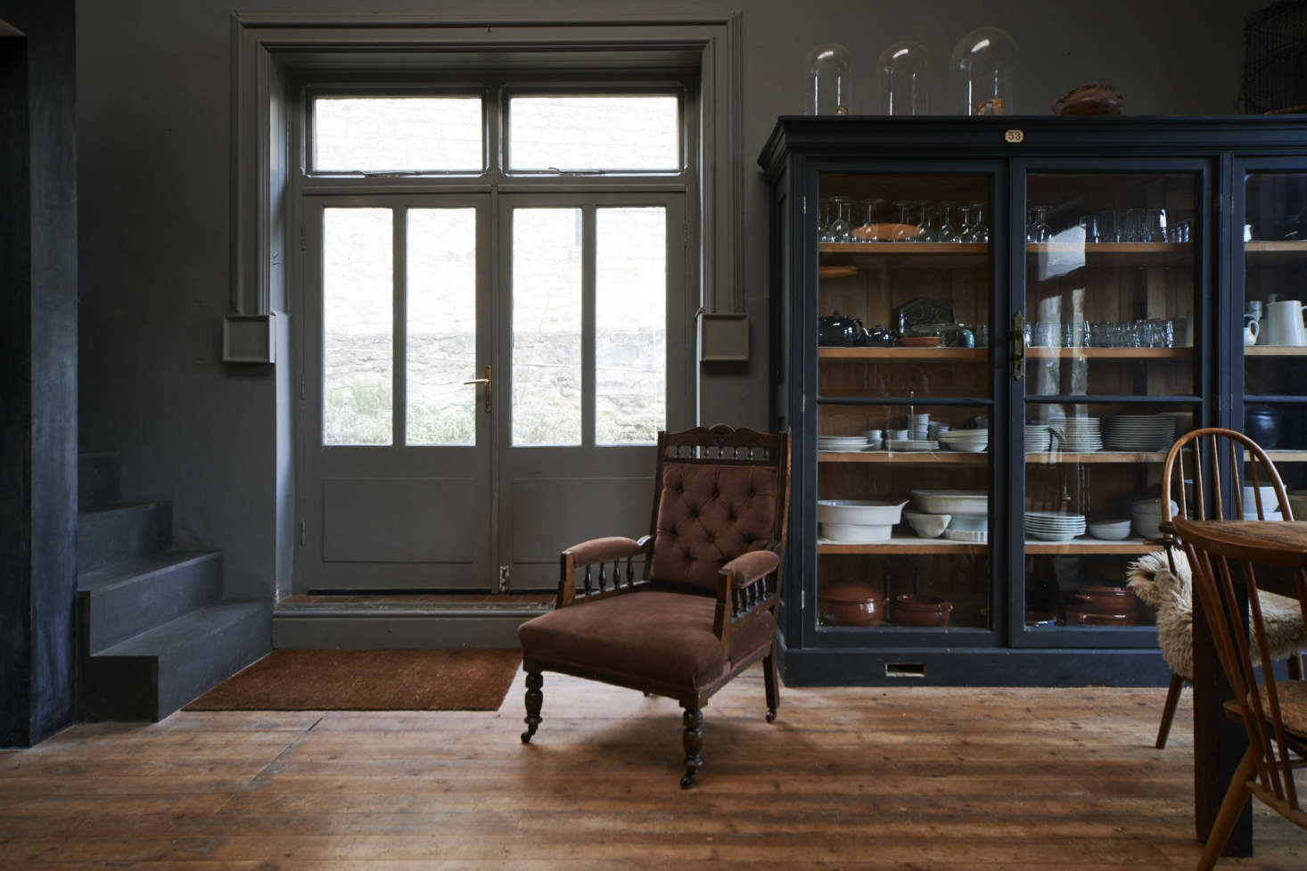 French doors, painted the same color as the walls, in On the Market: A Historic House Reimagined for a Modern Family in Stroud, England.
