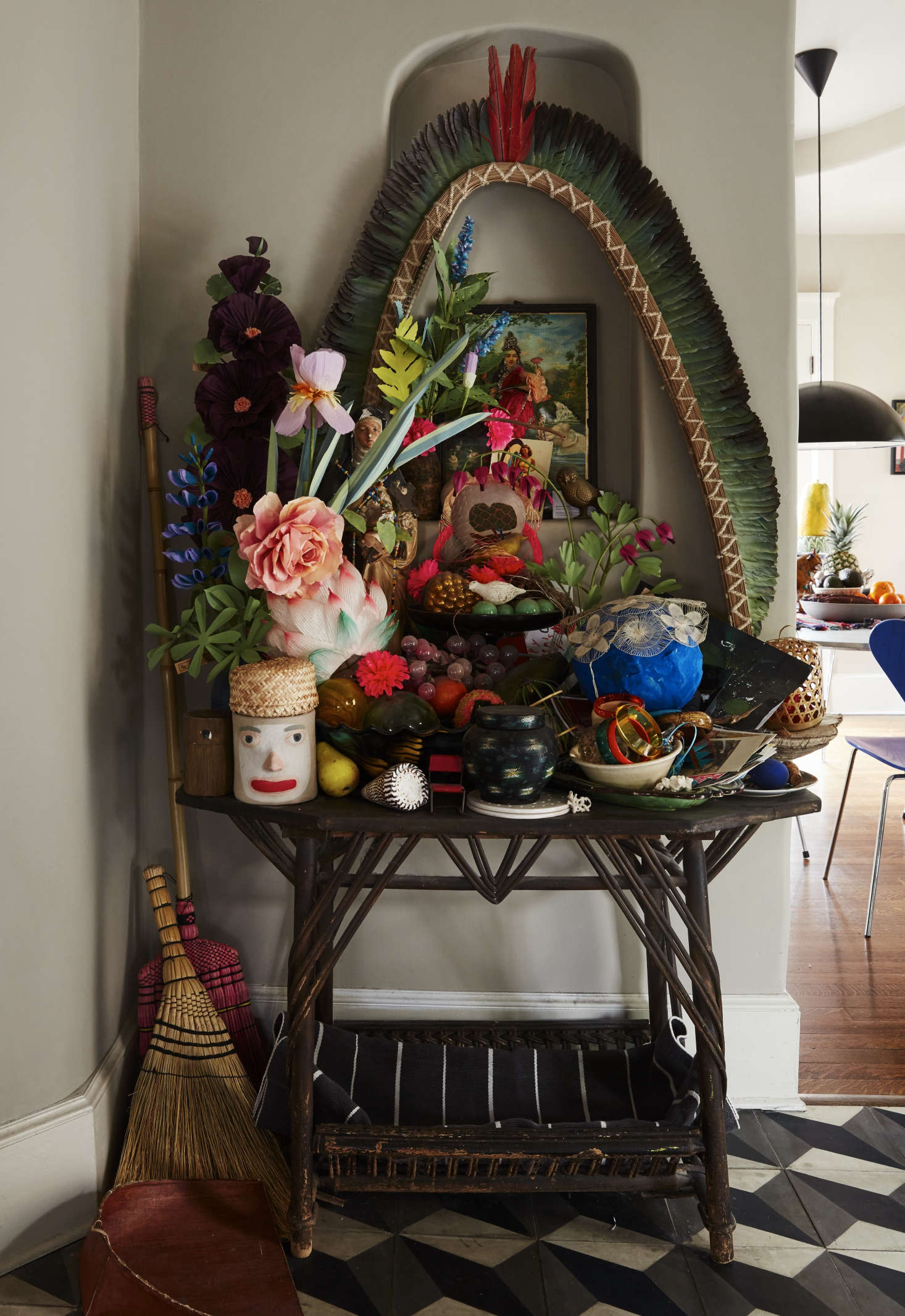 An ever-growing shrine rises in a recess that Danny built between the kitchen and living room. It