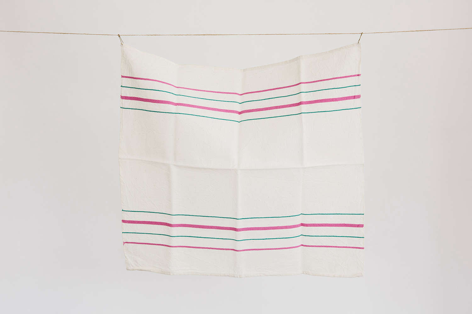 pink and green striped white linen towel set at housewares store set and co. in 25