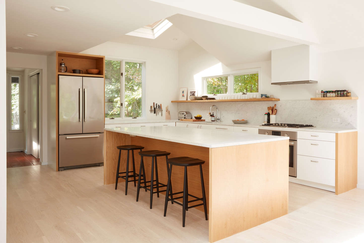In addition to removing the kitchen wall, Jones and team lofted the ceiling. (The skylight was original—the ceiling was 