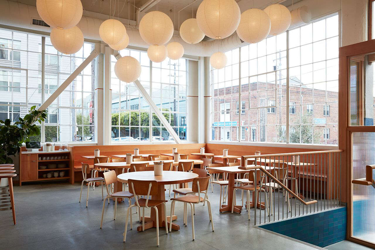 Uniform cream powder-coated chairs make for a pared-back look in Tartine Manufactory in San Francisco. For more, see 7 Ideas to Steal from the Manufactory in SF by Commune Design.