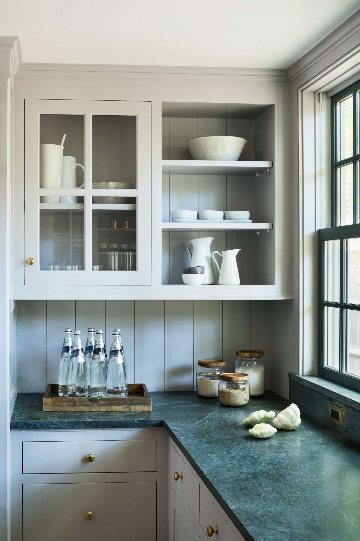 Green soapstone countertops in a farmhouse by architect Rafe Churchill; see Architect Visit: A Renovated Farmhouse in Bedford with Scandinavian Influences. While soapstone does not require much in terms of daily maintenance, it shows signs of wear and tear and develops a patina over time. To ensure that it darkens evenly, regular applications of mineral oil are recommended. Photograp by Amanda Kirkpatrick, courtesy of Rafe Churchill; styling by Anna Molvik.