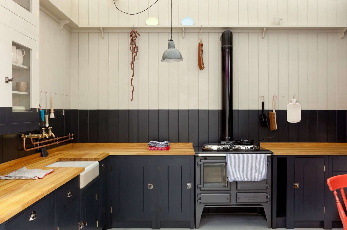 A butcher block countertop in a British Standard Cupboard Kitchen by Plain English.