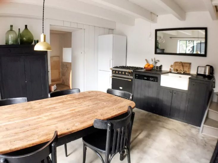 we love the rustic eat in kitchen at la maison du figuier, an airbnb on france& 26