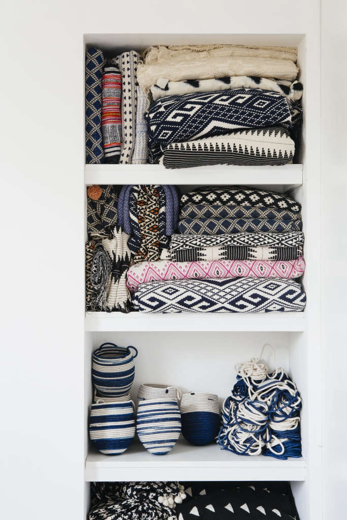 blankets and baskets, ready to be sold, are efficiently stored in built in 23