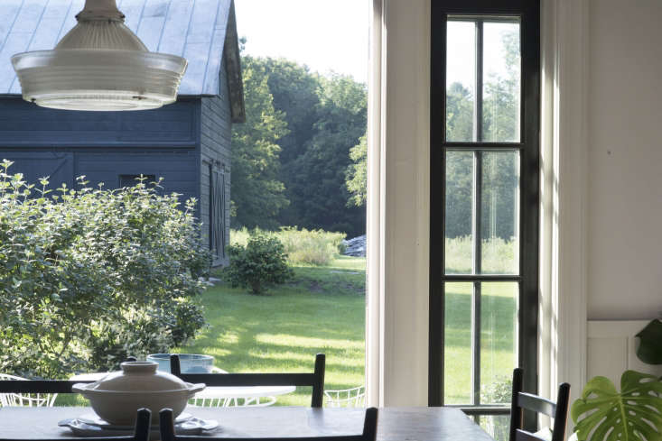  the dining room looks out to the renovated barn, now painted in sherwin w 28