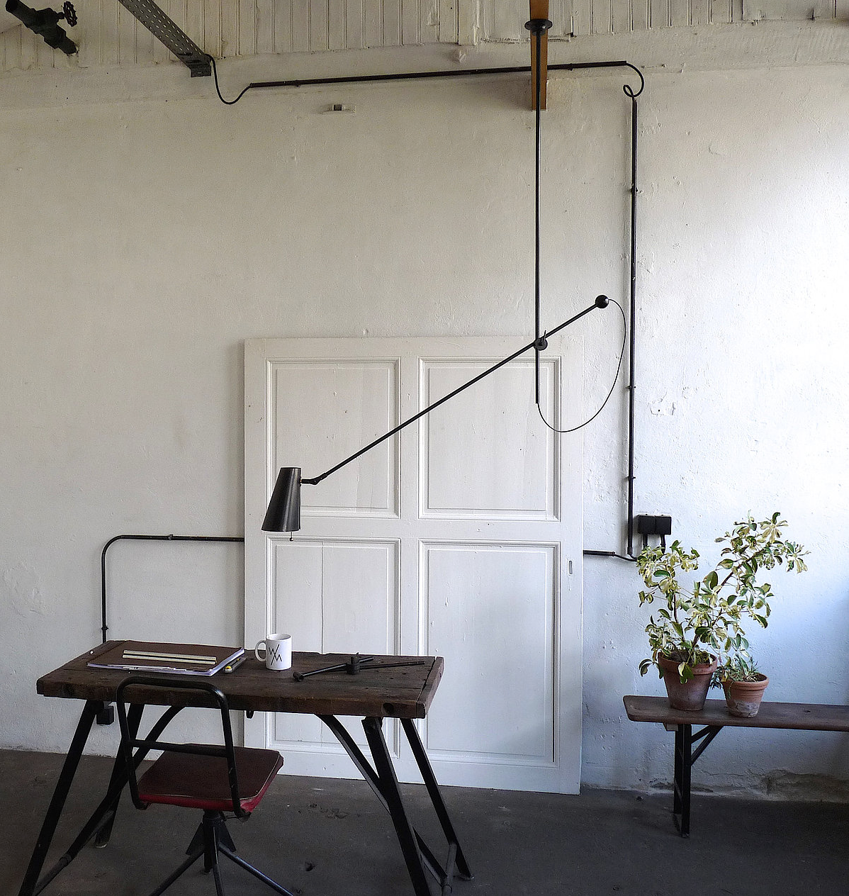 Ideal for workspaces, the Adjustable One Arm Chandelier can be levered according to lighting needs; €549 ($583).