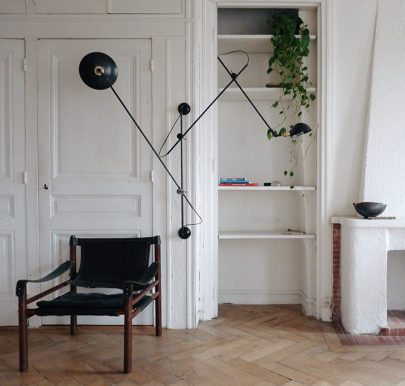 The Adjustable Three Arms Wall Lamp has a black steel finish; €859 ($9data-src=