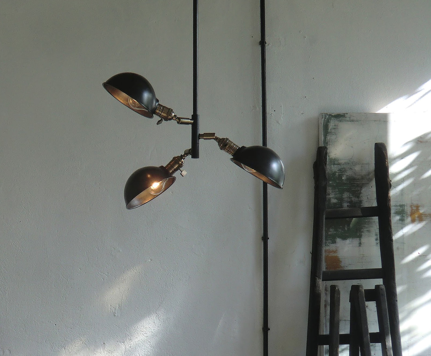 The Auguste Three Lights Ceiling fixture is €659 ($700), shown here with steel cup shades.