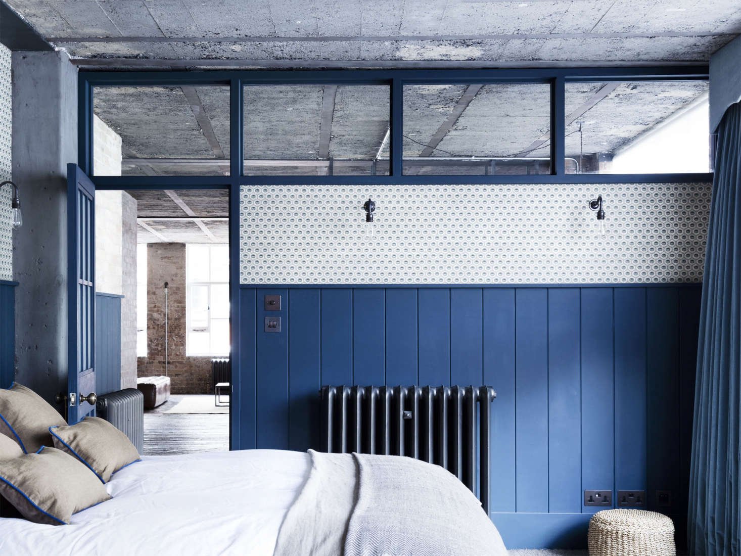 Mark sourced the reconditioned metal radiators from Salvage Doctor. Photograph by Rory Gardener from A “Modern Victorian” Loft in London by Mark Lewis.