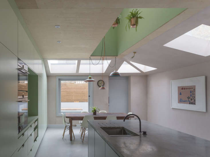 the kitchen is defined by pastel colors and a series of series of geometric
 18