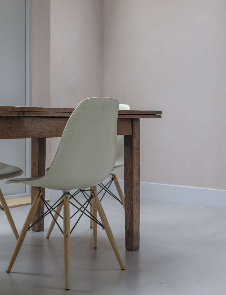 the family&#8\2\17;s longstanding wood dining table is paired with eames do 21