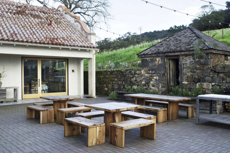 custom pivot doors open from the kitchen onto the courtyard, connecting the kit 18