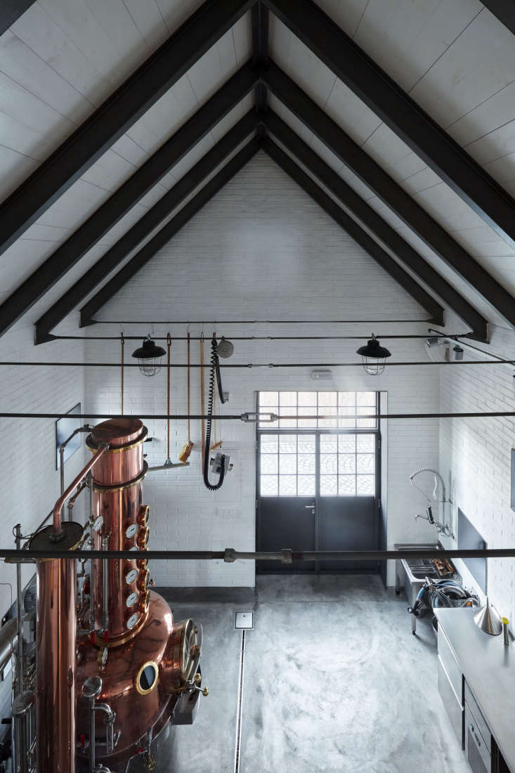  with black beams and a concrete floor, the distillery itself is utilitari 20