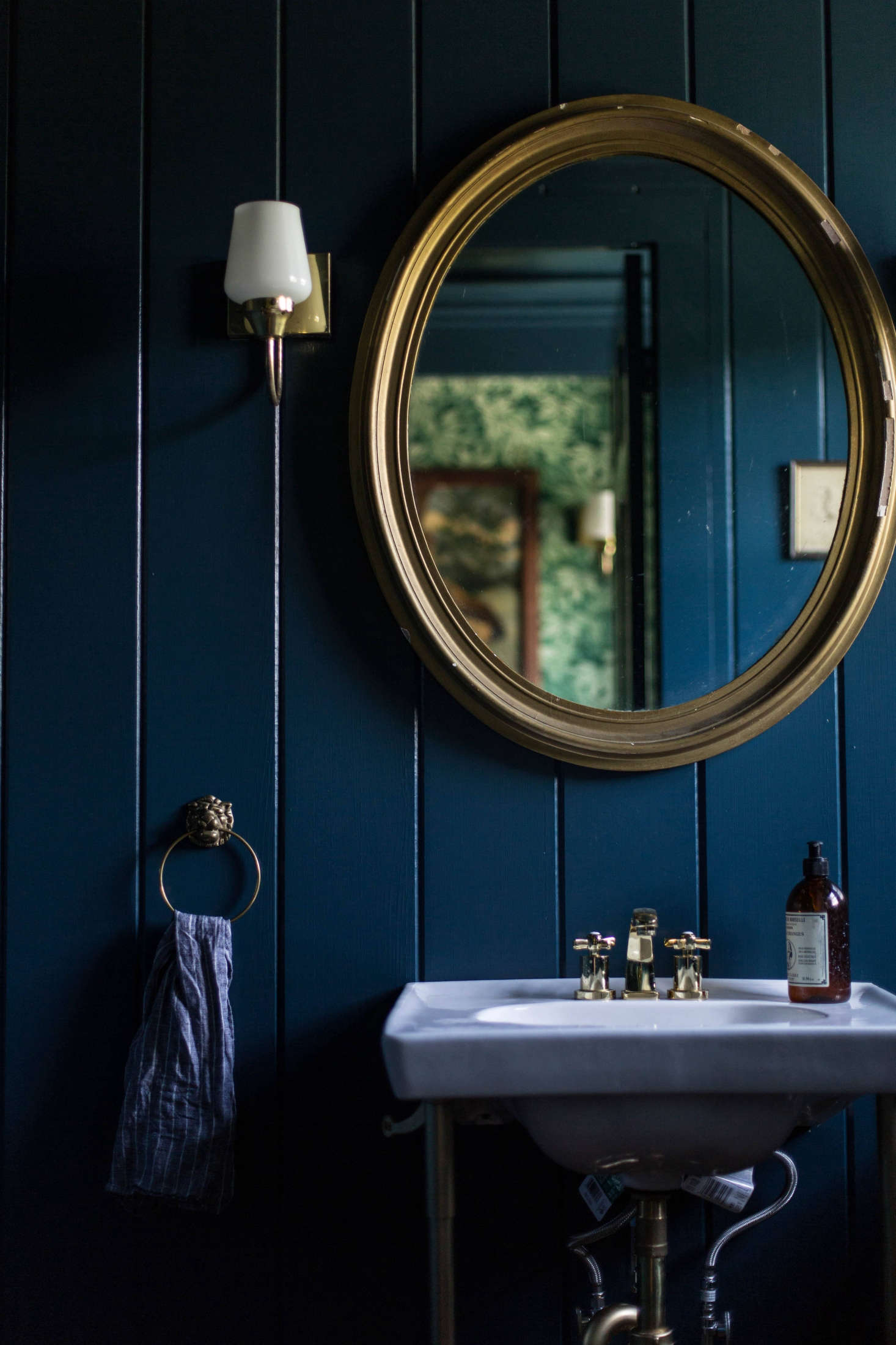 Painted a deep indigo, rustic V-groove suddenly takes on a more glamorous air. (See: A Country House Reinvented by Jersey Ice Cream Co.) Photograph by Beth Kirby of Local Milk.