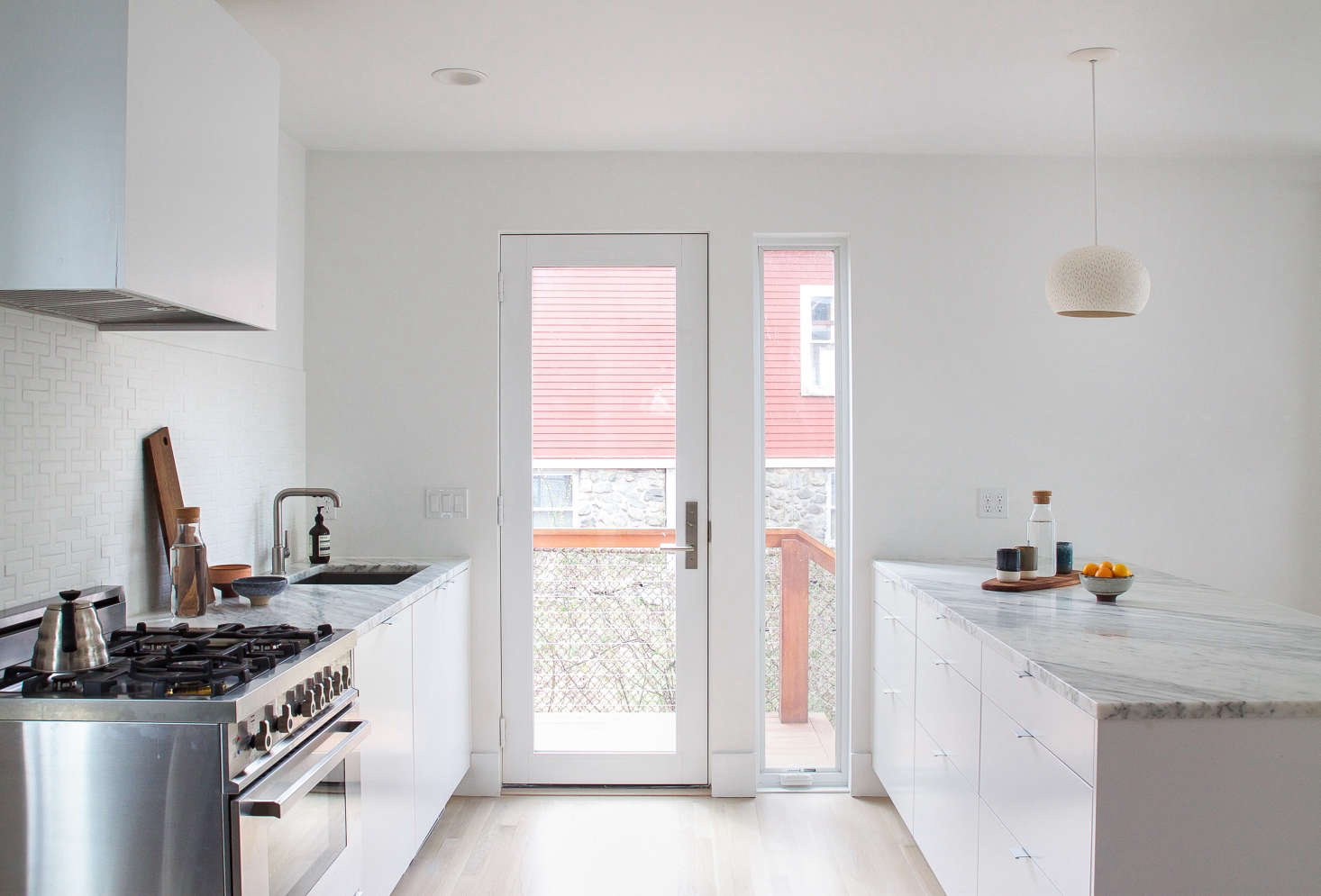 A coat of Benjamin Moore Super White Paint in matte reflects light and brightens a previously dark Boston kitchen. Photograph by Justine Hand for Remodelista, from Reader Rehab: A Boston Kitchen Embraces the Light.