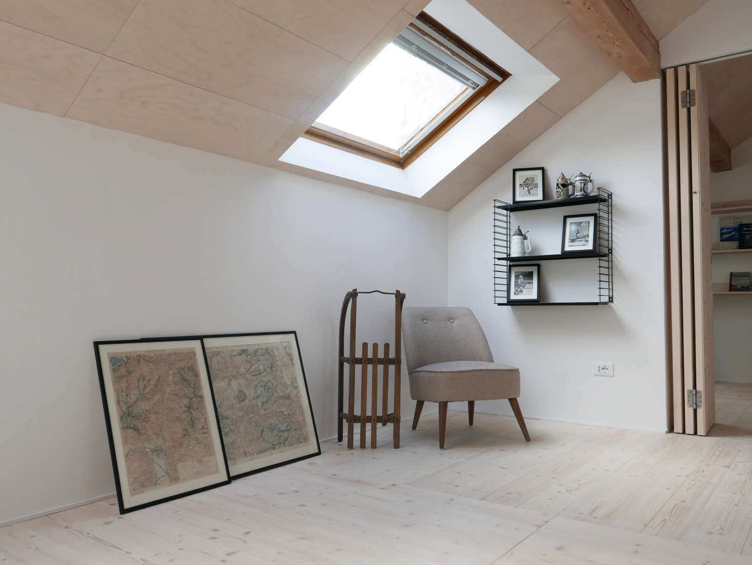 A plywood ceiling in A Light-Filled Chalet in the Italian Alps, Updated for a Young Skier.