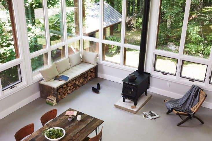 a bench at the table on ten retreat in the catskills is built from stacks of wo 18