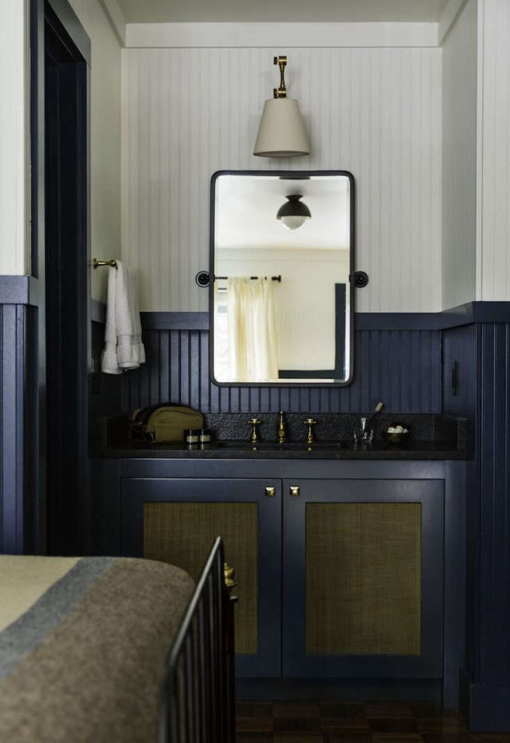 the guest bathrooms have brass fixtures by waterworks, lighting designed by all 23