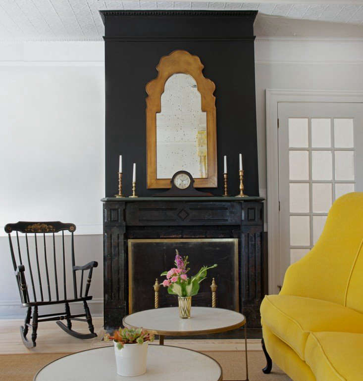 Updated Victorian, the Chequit Inn on Shelter Island, New York, strikes a vintage-modern balance with black accents and a bold yellow sofa. See The Chequit Inn: A Grand Dame Reopens on Shelter Island.