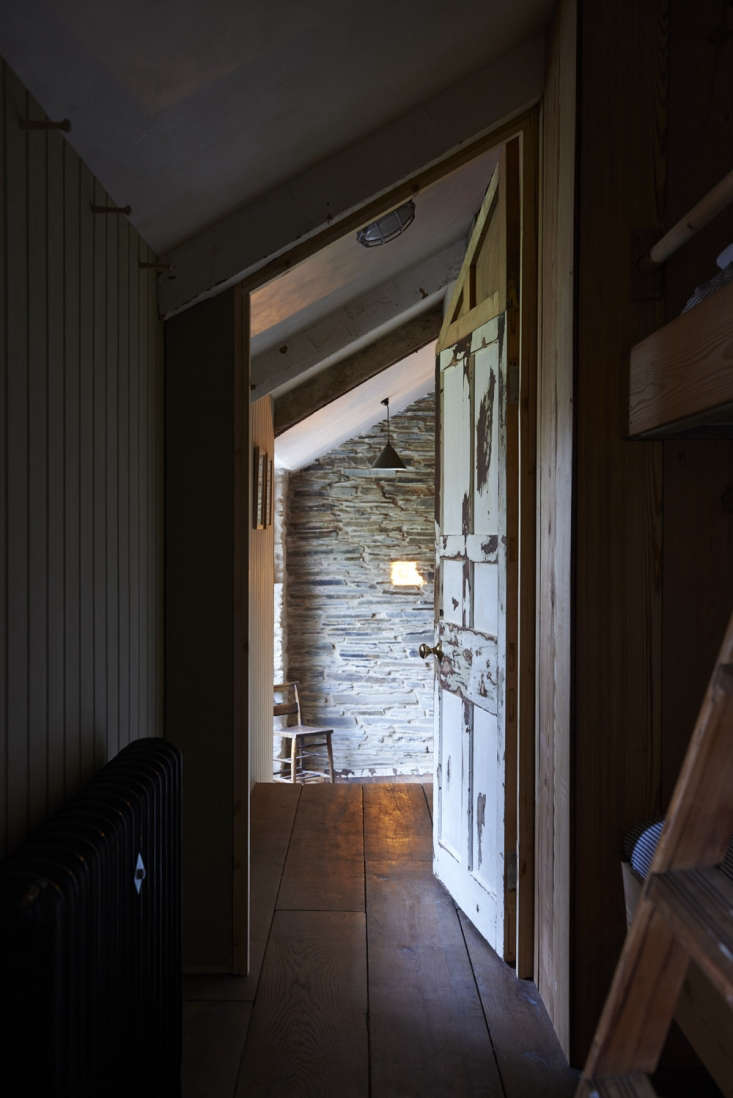 upstairs details such as the paneling and old door evoke a cottage like charm. 24