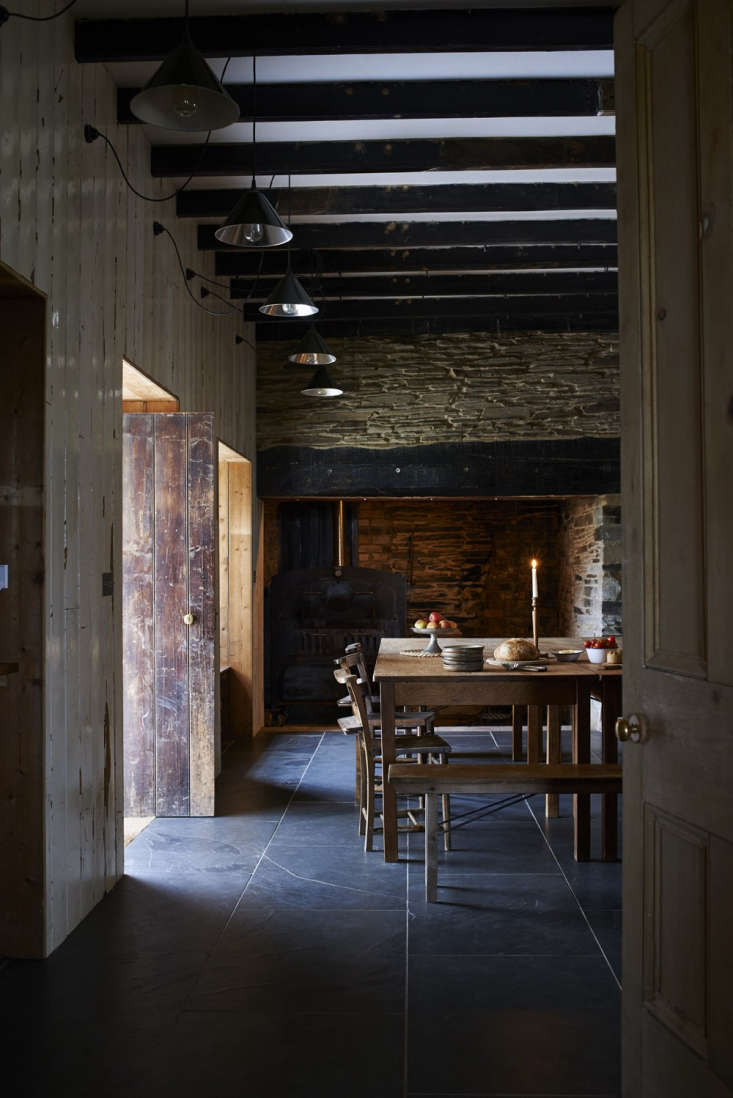 original doors illuminate the kitchen interior. the high ceilings feature salva 19